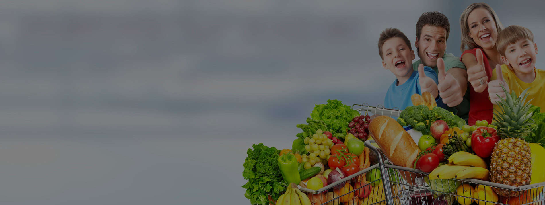 Happy family with a shopping cart full of fresh groceries